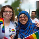 Muslim woman and Canadian woman marching in the 36th Pride